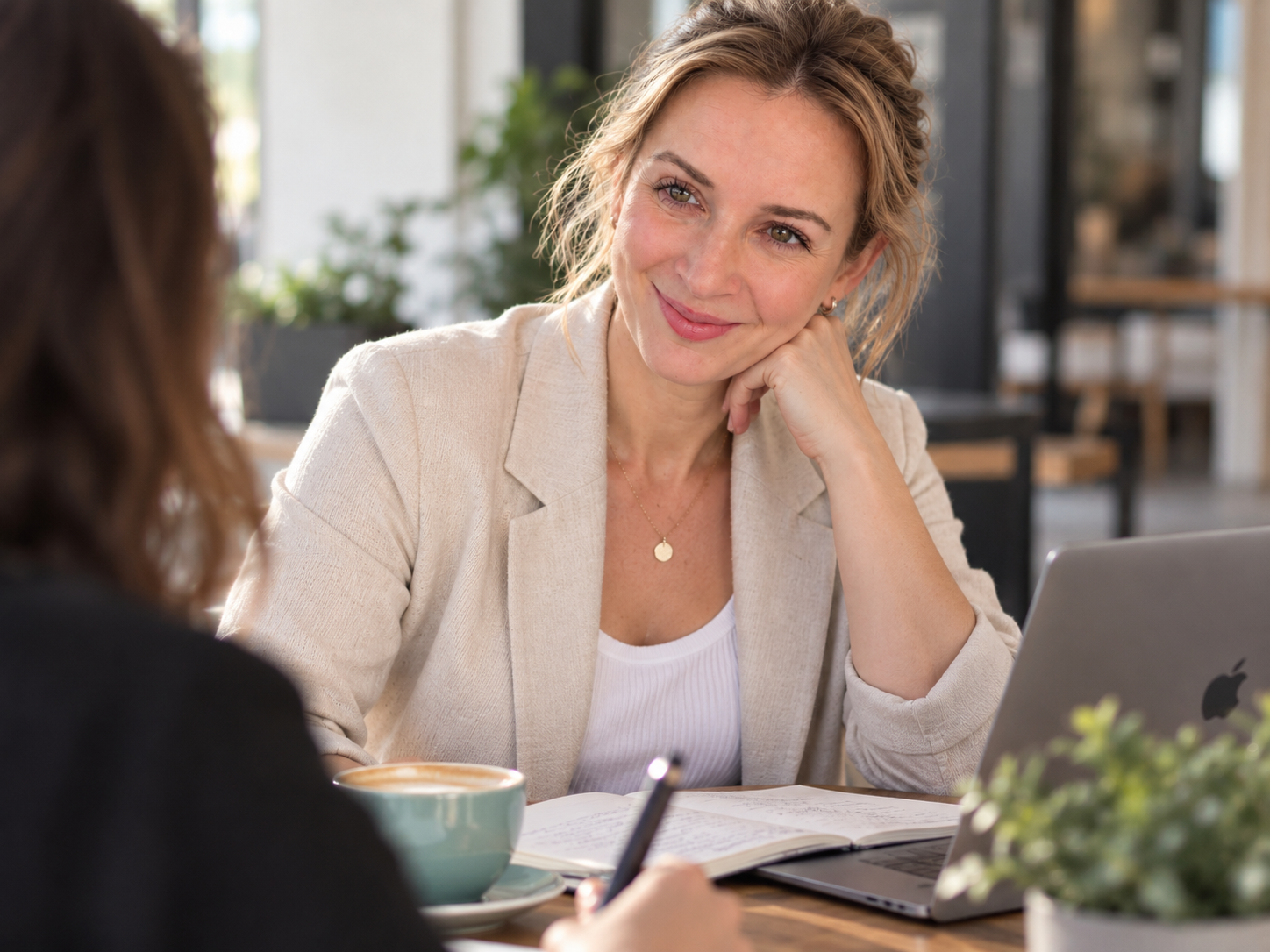 Steph in a relaxed working conversation with a client